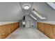Finished attic featuring skylights and paneled walls at 1965 Sterling Creek Ct, Snellville, GA 30078