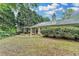 View of the home's backyard with patio and pergola at 1965 Sterling Creek Ct, Snellville, GA 30078