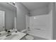 Bright bathroom with combined shower and tub and a vanity at 1965 Sterling Creek Ct, Snellville, GA 30078