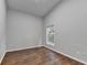 Bedroom featuring hardwood floors, a window, and neutral gray walls at 1965 Sterling Creek Ct, Snellville, GA 30078