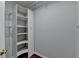 Walk-in closet with wire shelving and laminate floors at 1965 Sterling Creek Ct, Snellville, GA 30078
