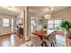Open dining room features wood-look floors and plenty of natural light at 1965 Sterling Creek Ct, Snellville, GA 30078