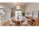 Dining room features wood-look floors and elegant furnishings at 1965 Sterling Creek Ct, Snellville, GA 30078