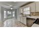 Bright eat-in kitchen featuring stainless steel appliances, a bay window, and ample counter space at 1965 Sterling Creek Ct, Snellville, GA 30078