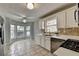 Bright kitchen features tile floors and stainless steel appliances at 1965 Sterling Creek Ct, Snellville, GA 30078