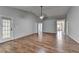 Spacious living room featuring hardwood floors with access to additional rooms and a backyard at 1965 Sterling Creek Ct, Snellville, GA 30078