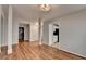 Open concept living room with neutral paint and wood look floors at 1965 Sterling Creek Ct, Snellville, GA 30078