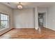 An open living room with hardwood floors and natural lighting through a large window at 1965 Sterling Creek Ct, Snellville, GA 30078