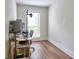 Bedroom with wood floors and a window offering natural light is perfect for an office or study at 2210 Cumberland Se Ct, Smyrna, GA 30080