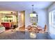 Open-concept dining room with a mirrored accent wall, and plenty of natural light at 2210 Cumberland Se Ct, Smyrna, GA 30080
