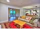 Cozy living room with a comfortable couch, decorative pillows, a wooden coffee table, and access to an outdoor balcony at 2210 Cumberland Se Ct, Smyrna, GA 30080