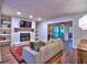 Bright living room with a fireplace, built-in shelves, and an open layout at 2210 Cumberland Se Ct, Smyrna, GA 30080
