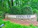 Welcome to Vinings Run community, featuring lush landscaping at the entrance at 2210 Cumberland Se Ct, Smyrna, GA 30080