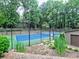 Enjoy a game of tennis at the community tennis court surrounded by lush trees at 2210 Cumberland Se Ct, Smyrna, GA 30080