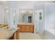 Primary bath featuring double sinks, a tub, and ample lighting at 4001 English Valley Dr, Ellenwood, GA 30294