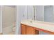 Bright bathroom featuring a single sink vanity, framed mirror, and tub with shower at 4001 English Valley Dr, Ellenwood, GA 30294