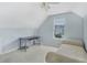 Well lit bedroom with neutral colored walls, carpet, and an exterior view at 4001 English Valley Dr, Ellenwood, GA 30294