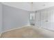 Bedroom with carpet, neutral walls, closet, and access to the hallway at 4001 English Valley Dr, Ellenwood, GA 30294