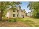 View of a well-maintained home's exterior from the backyard with trees at 4001 English Valley Dr, Ellenwood, GA 30294