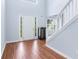 Open and bright foyer with hardwood floors, stairs, and ample natural light at 4001 English Valley Dr, Ellenwood, GA 30294