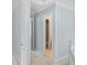 Hallway with neutral walls and trim leading to bedrooms and bathrooms at 4001 English Valley Dr, Ellenwood, GA 30294