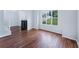 Bright living room with hardwood floors, a large window and neutral paint colors at 4001 English Valley Dr, Ellenwood, GA 30294