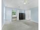 Light-filled main bedroom boasts vaulted ceilings, carpet, and ample closet space at 4001 English Valley Dr, Ellenwood, GA 30294