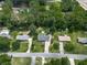 High-angle aerial view of the property, with its spacious location, landscaping, driveway, and neighborhood at 464 Mason Dr, Canton, GA 30115