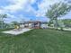 Lush backyard with a cozy fire pit, covered patio with outdoor kitchen, and ample green space at 464 Mason Dr, Canton, GA 30115