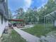 Expansive backyard featuring a covered patio, fire pit area, and ample green space at 464 Mason Dr, Canton, GA 30115
