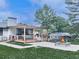 Backyard oasis with a covered deck, outdoor kitchen, fire pit, and meticulously maintained lawn at 464 Mason Dr, Canton, GA 30115
