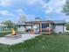 Backyard features a stone firepit, wooden pergola, and covered grilling station, perfect for outdoor entertaining at 464 Mason Dr, Canton, GA 30115