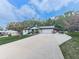 Charming single-story home with a well-manicured lawn and a long driveway at 464 Mason Dr, Canton, GA 30115