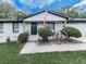 Charming front porch with decorative wagon wheels, a well-kept lawn, and American flag at 464 Mason Dr, Canton, GA 30115
