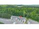 Aerial view of new townhomes surrounded by a lush forest at 5095 Lower Elm St, Atlanta, GA 30349