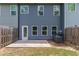 Townhome backyard featuring a small patio and privacy fence at 5095 Lower Elm St, Atlanta, GA 30349