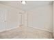 Neutral-toned bedroom featuring carpet, a ceiling light and 2 entryways at 5095 Lower Elm St, Atlanta, GA 30349