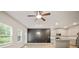 Open-concept living space with a modern kitchen featuring stainless steel appliances and a center island at 5095 Lower Elm St, Atlanta, GA 30349
