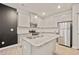 Stylish kitchen with granite countertops, stainless steel appliances, and a convenient center island at 5095 Lower Elm St, Atlanta, GA 30349