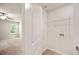 Inside the laundry room, the door is open to the neutral-colored bedroom with natural lighting at 5095 Lower Elm St, Atlanta, GA 30349