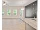 Stylish open living space featuring a quartz countertop island and a large accent wall with a clock at 5095 Lower Elm St, Atlanta, GA 30349