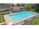 Community pool with lounge chairs, tables, and playground at 5095 Lower Elm St, Atlanta, GA 30349