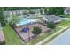 Community pool with lounge chairs, playground, and surrounding townhomes at 5095 Lower Elm St, Atlanta, GA 30349
