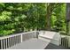 Relaxing deck space, with seating, nestled amidst lush greenery for privacy and tranquility at 545 Willow Creek Dr, Temple, GA 30179