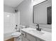 Bathroom featuring a shower-tub combo, modern fixtures, and vanity with a framed mirror at 545 Willow Creek Dr, Temple, GA 30179