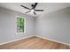 Bedroom featuring a ceiling fan, and a large window at 545 Willow Creek Dr, Temple, GA 30179