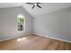 Bedroom featuring a vaulted ceiling, fan, and a arched window at 545 Willow Creek Dr, Temple, GA 30179