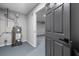 Utility area with a water heater and doorway with gray door to an adjacent room at 545 Willow Creek Dr, Temple, GA 30179