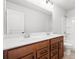 Bathroom featuring a double sink vanity with wood cabinets and a shower-tub combination at 1619 Tide Mill Road, Cumming, GA 30040