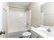 Bright bathroom featuring a shower-tub combination and a white single sink vanity at 1646 Sandy Beach Pt, Lawrenceville, GA 30043